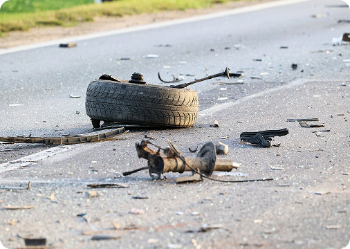 shredded tire on the road after crash