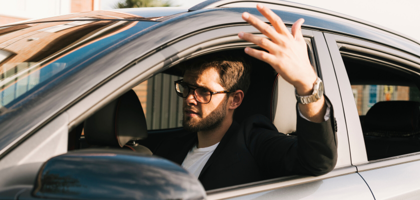 driver looking frustrated in vehicle