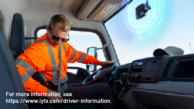 truck driver with in-cab fleet safety technology