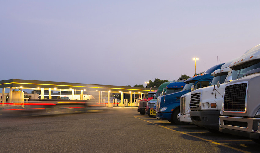 semi trucks at a gas station