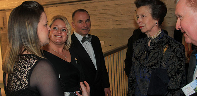 Lytx employees Jade Turner, (left) and Tessa Chamberlain, (right) meet with Her Royal Highness Princess Anne, The Princess Royal and Patron of Transaid.