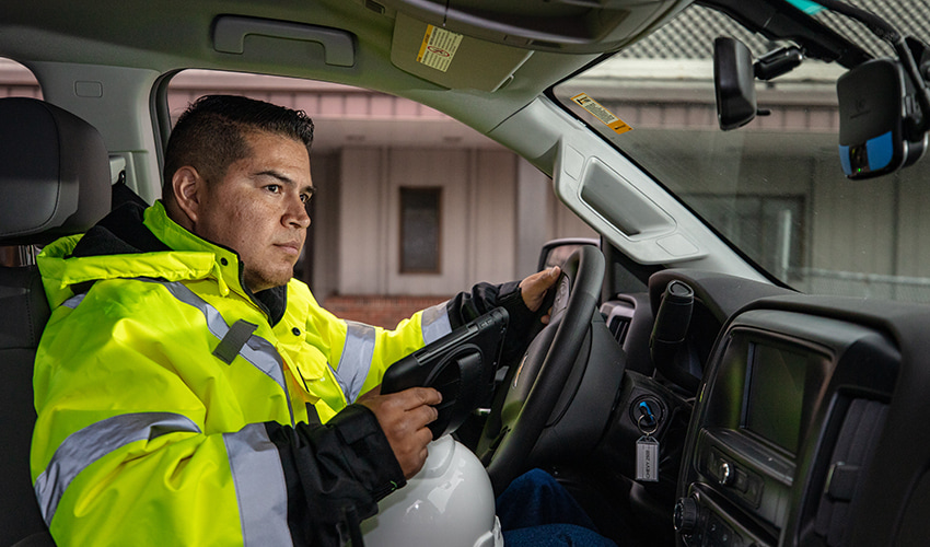 Driver in the cab of a vehicle