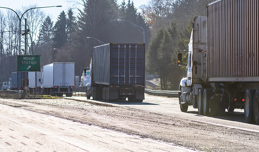 semi trucks waiting for weigh station