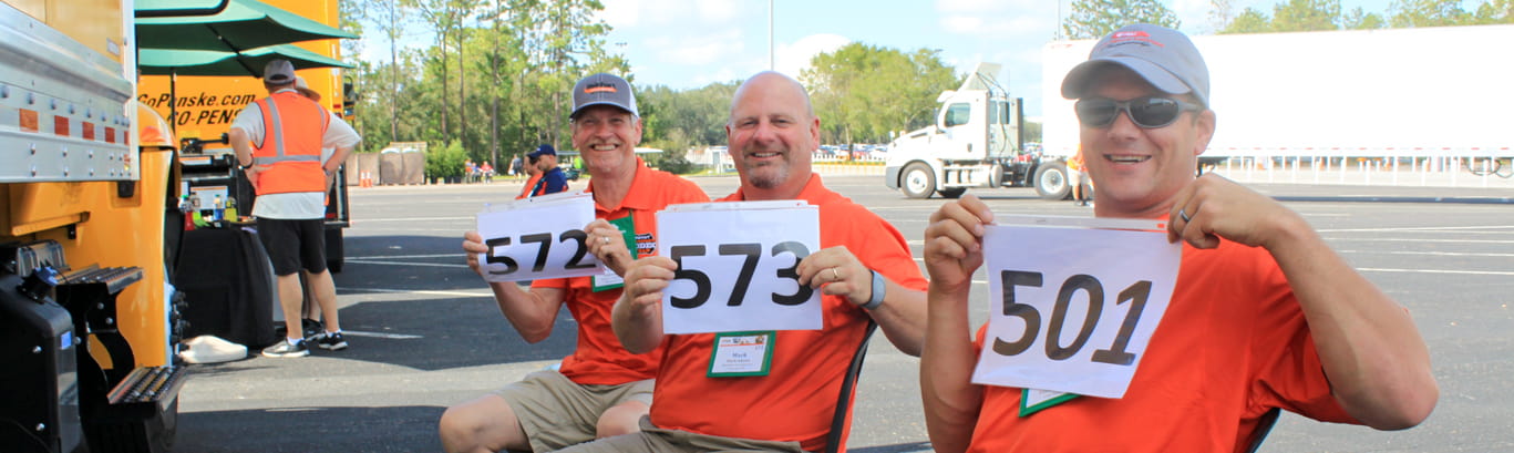 contestants holding up numbers