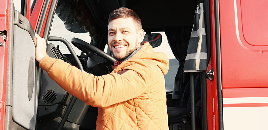 driver smiling as they get into a truck